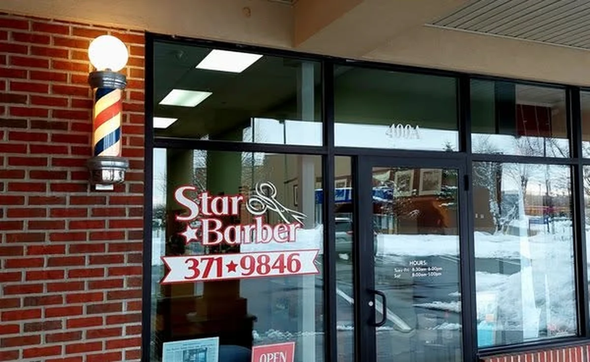 Star Barber Shop storefront and illuminated barber pole at the Shoppes of Halfmoon
