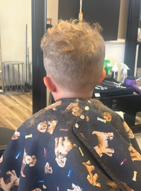 Fresh child’s haircut photographed inside the shop